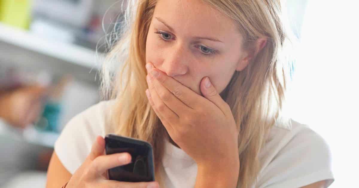 A-shocked-woman-looking-at-her-phone