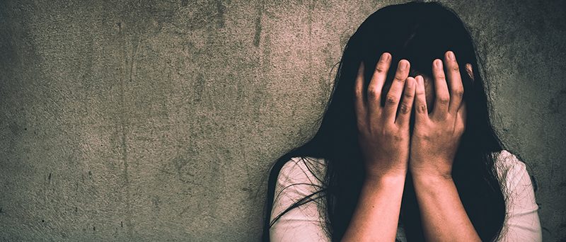 A woman sitting alone and depressed. FRVO, Family Court Proceedings