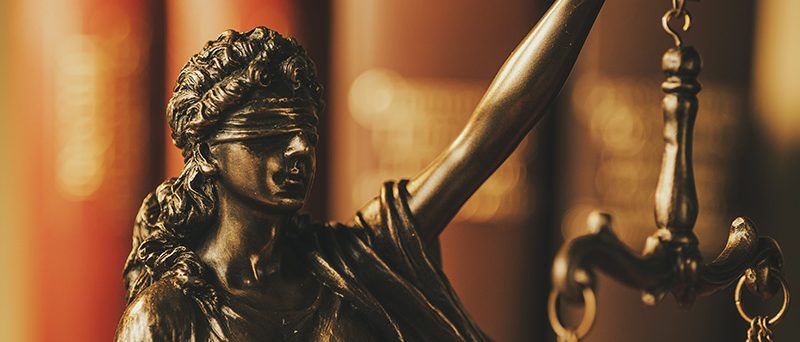 Blindfolded Justice holding up the scales