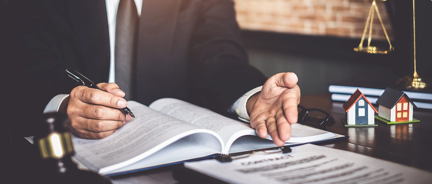 Close up of lawyer businessman working pointing at sign contract document in office workplace for consultant lawyer concept.