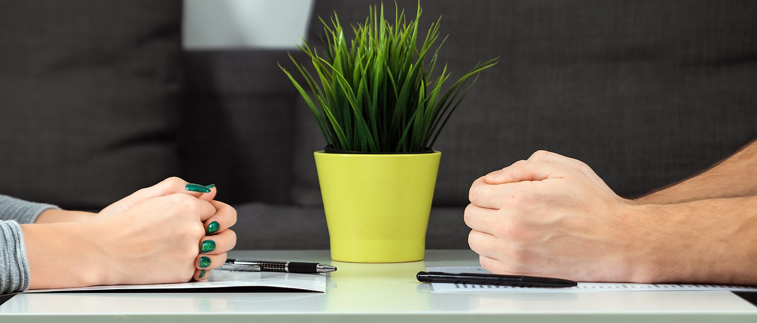 Male and female hands are folded opposite each other, close-up. Family quarrel, showdown, property division, divorce agreement